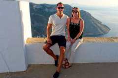 Couple sitting on wall