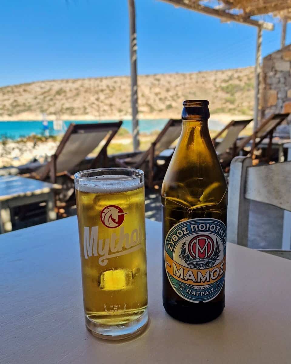 Mamos in a Mythos glass at Pera Panta Livadi Beach Iraklia