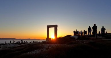 Spectacular sunset through Apollo's Gate on Naxos