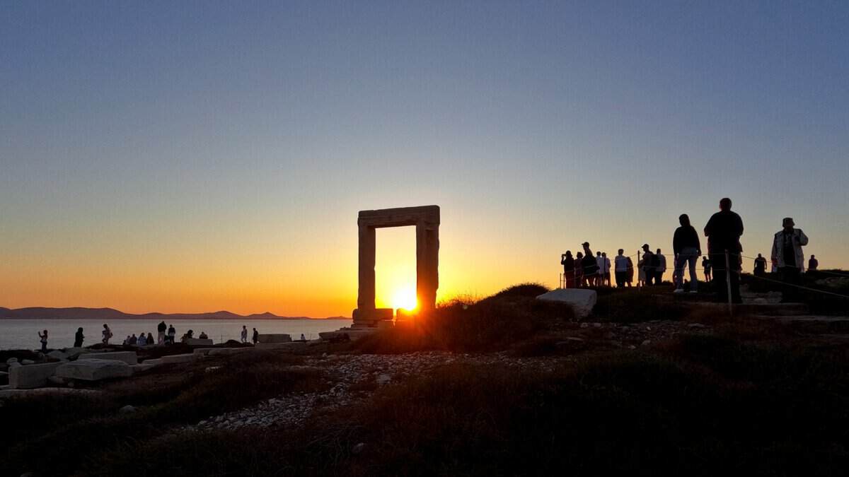 Spectacular sunset through Apollo's Gate on Naxos